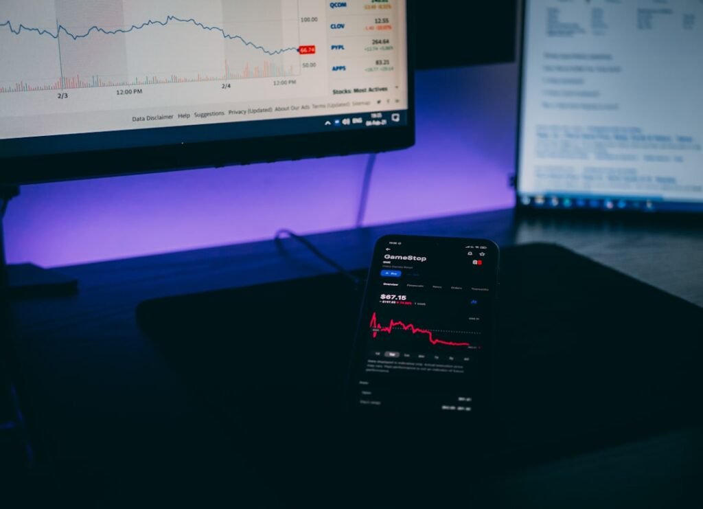 Stock market on laptop and phone